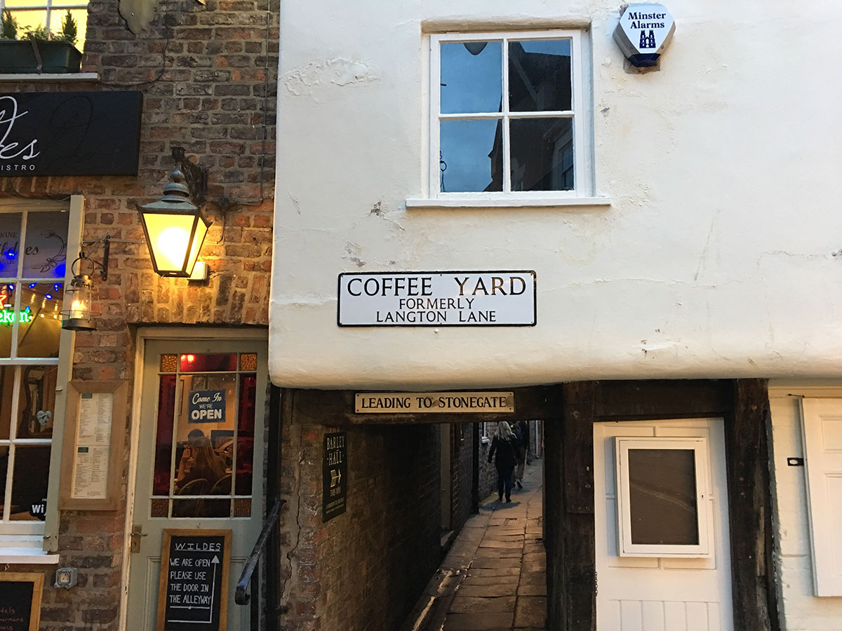 Water pours through ceiling of building in historic York courtyard