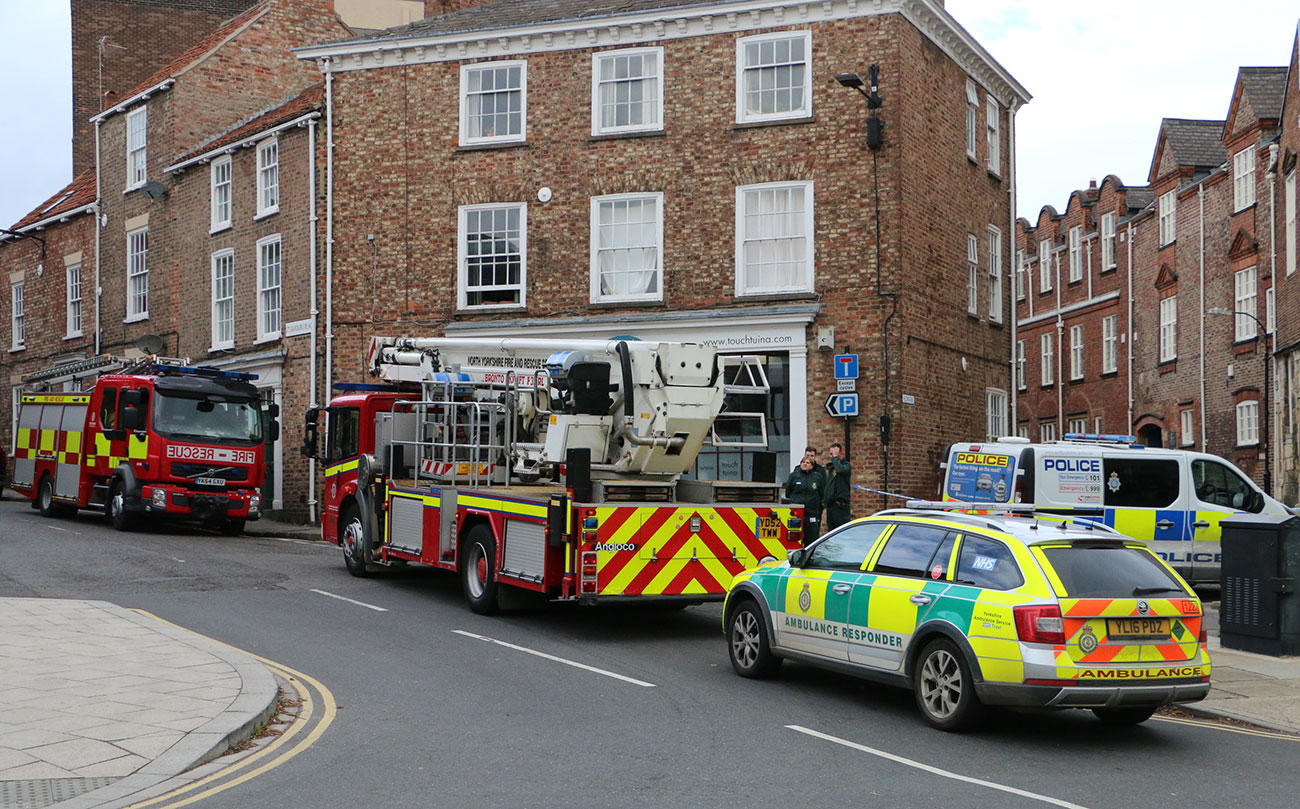 Updated: Man talked down safely from York roof after six hours