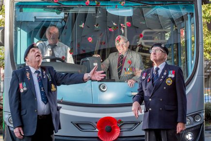 Buses sport giant poppies – and offer free travel to armed services personnel