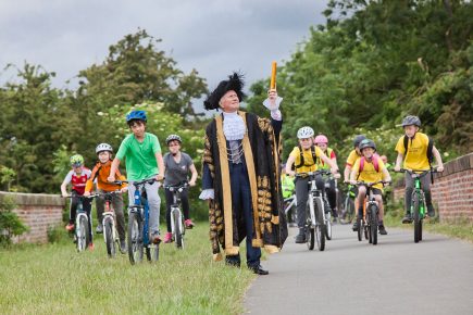 Pupils get on their bike for school baton relay