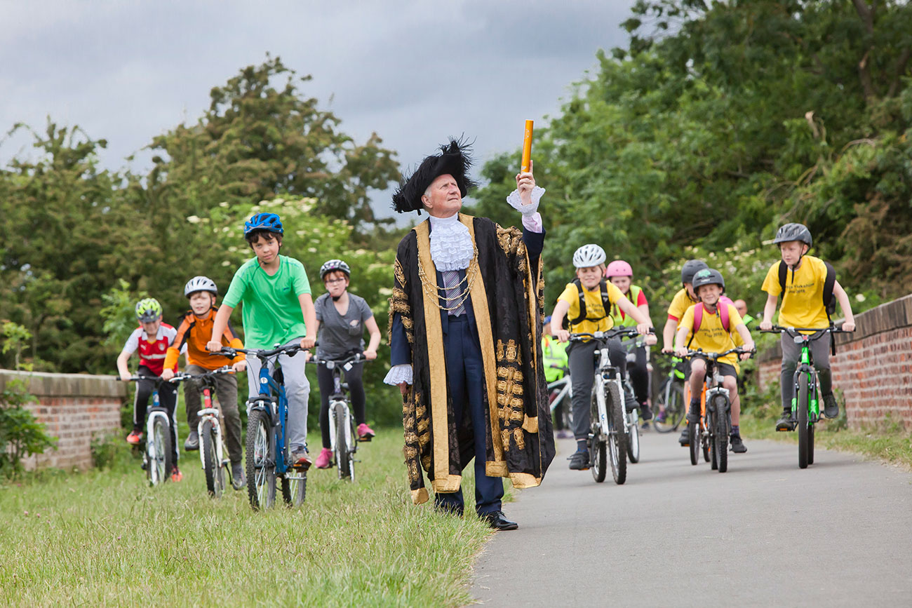 Pupils get on their bike for school baton relay