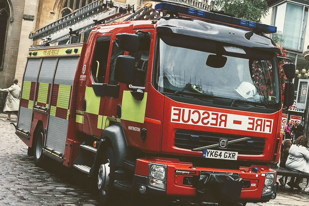 Firefighters cut free casualty trapped in overturned caravan after crash