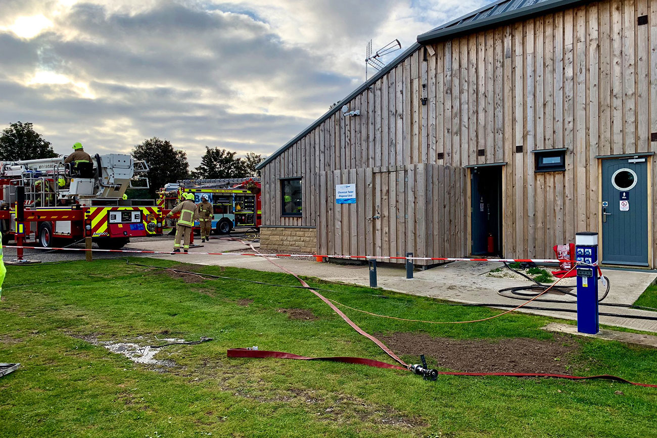 Five crews tackle building fire at York Marina