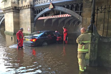 Updated: Two elderly people – and a dog – rescued from car stuck in floodwater