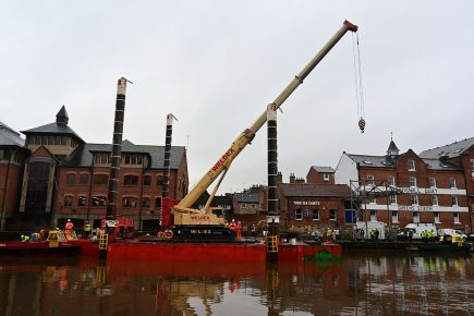 Huge crane floated down the river as Guildhall restoration enters new stage