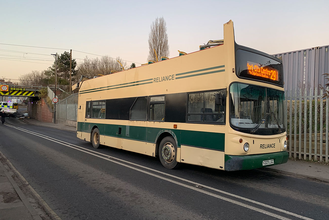 Bus hits low bridge in York – ripping off its roof