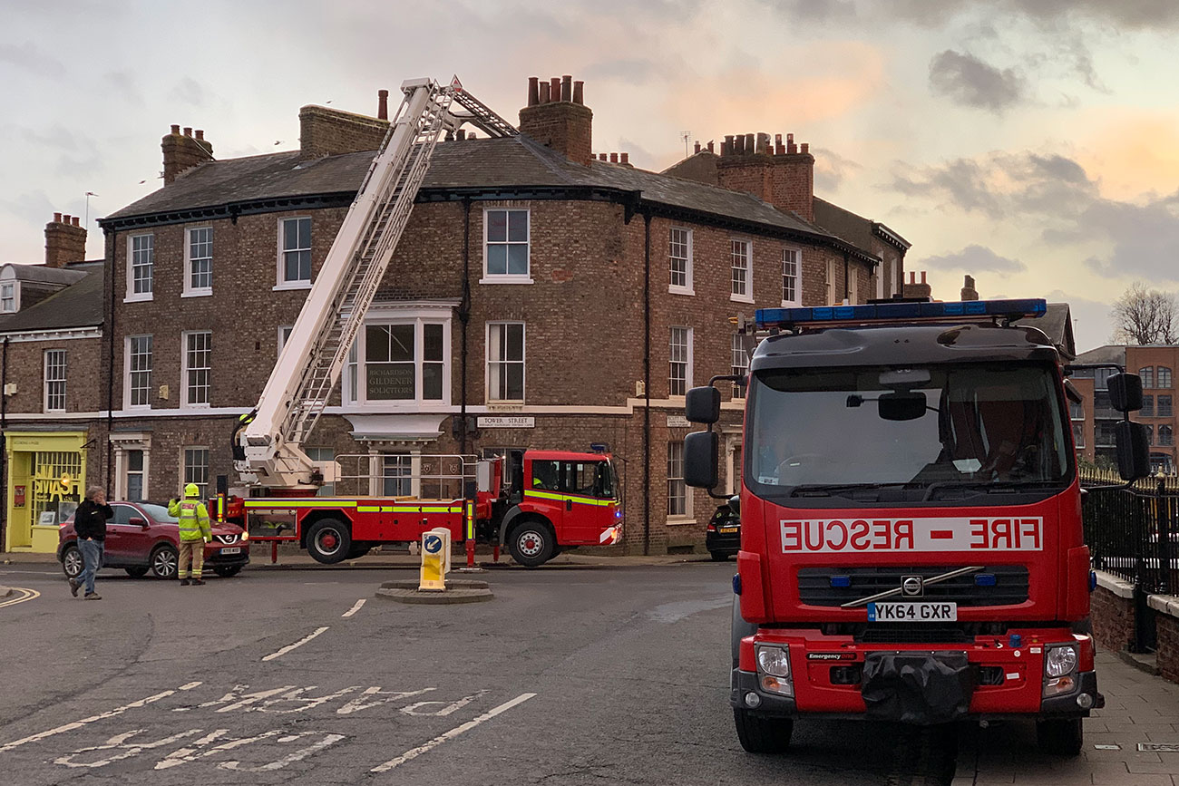 Firefighters work to secure dangerous city centre roof