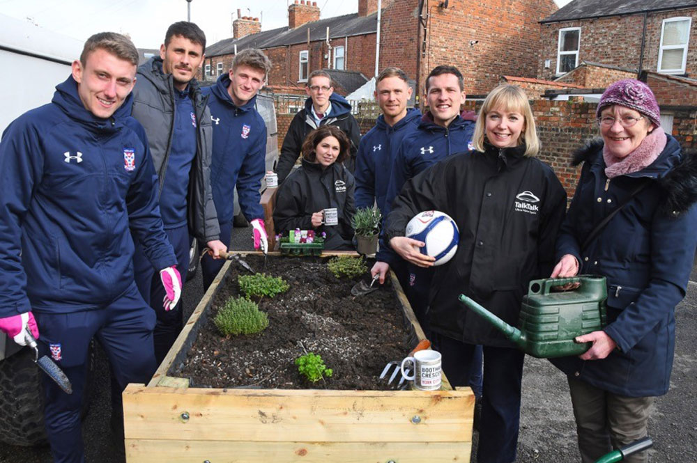 York City players dig in to help create a community garden