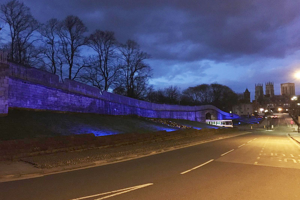 York’s walls turn blue in tribute to key workers – as thousands turn out to applaud their heroic efforts