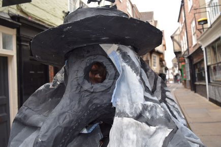 Plague doctor with mask and four-metre cape stalks the streets of York