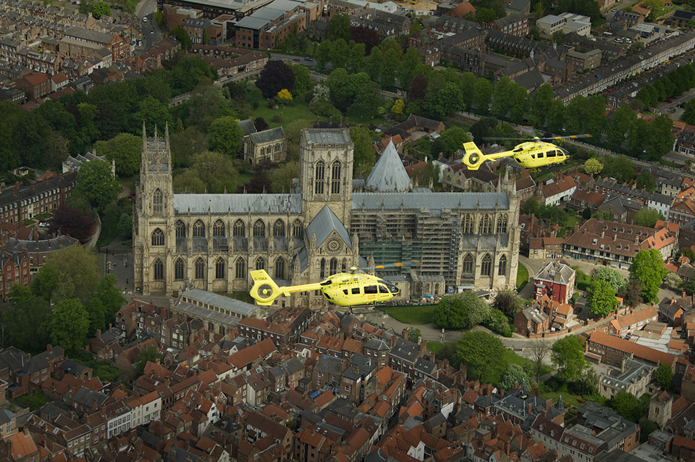 These breathtaking photographs show Yorkshire Air Ambulances flying over York Minster
