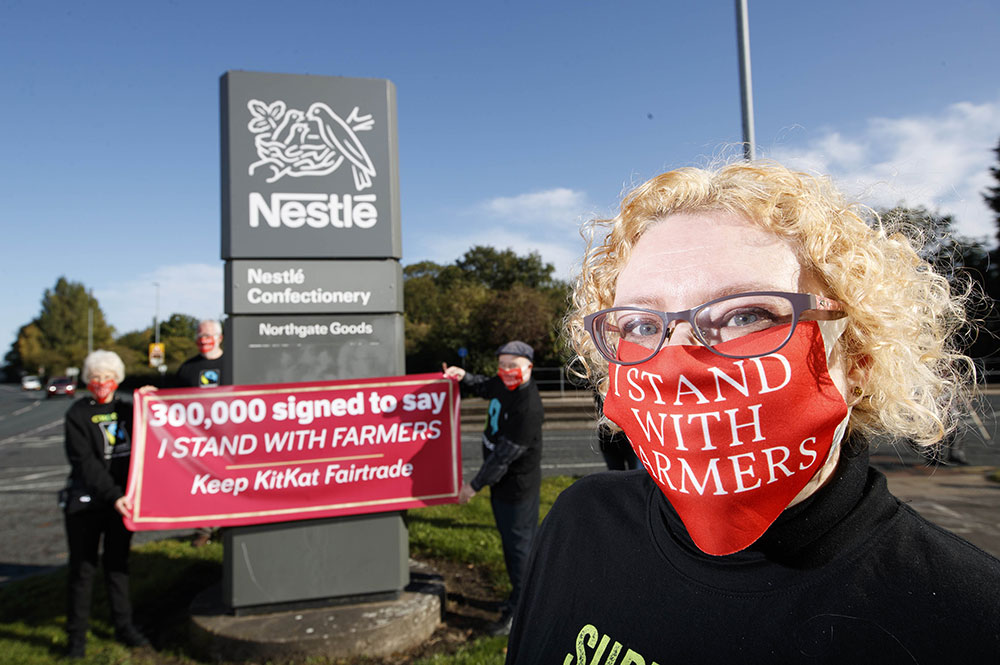 Campaigners deliver 300K-signature petition to Nestle in protest over ‘devastating’ KitKat trade deal