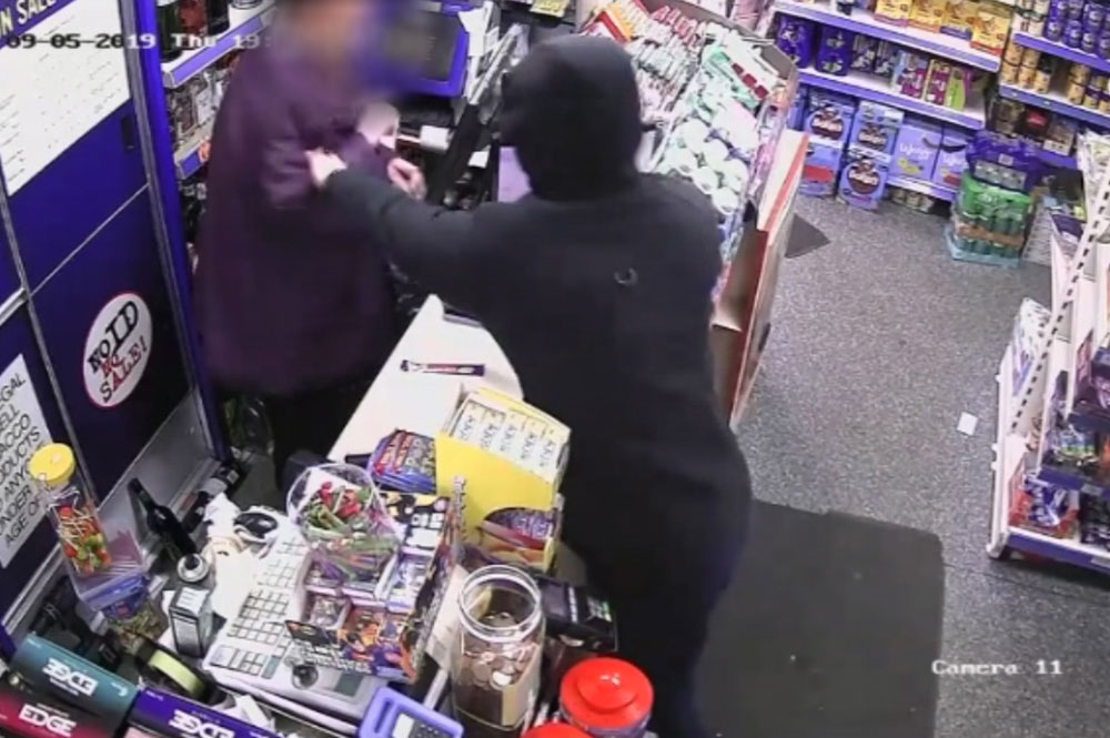 Dramatic pictures show the moment a teenager held a York shop worker at knifepoint