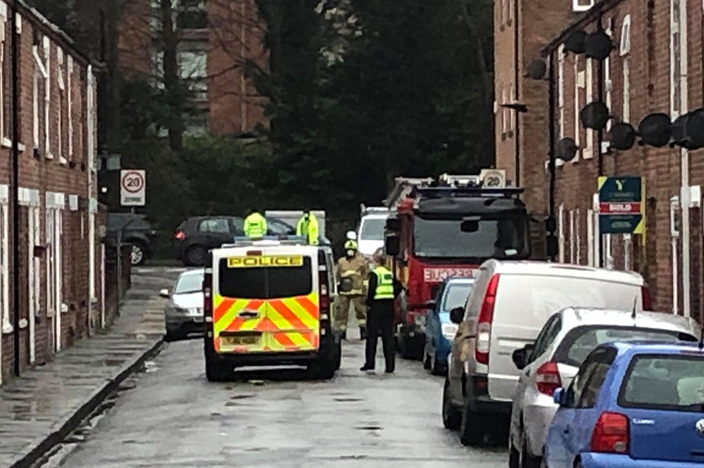 Chimney falls from York house and hits car