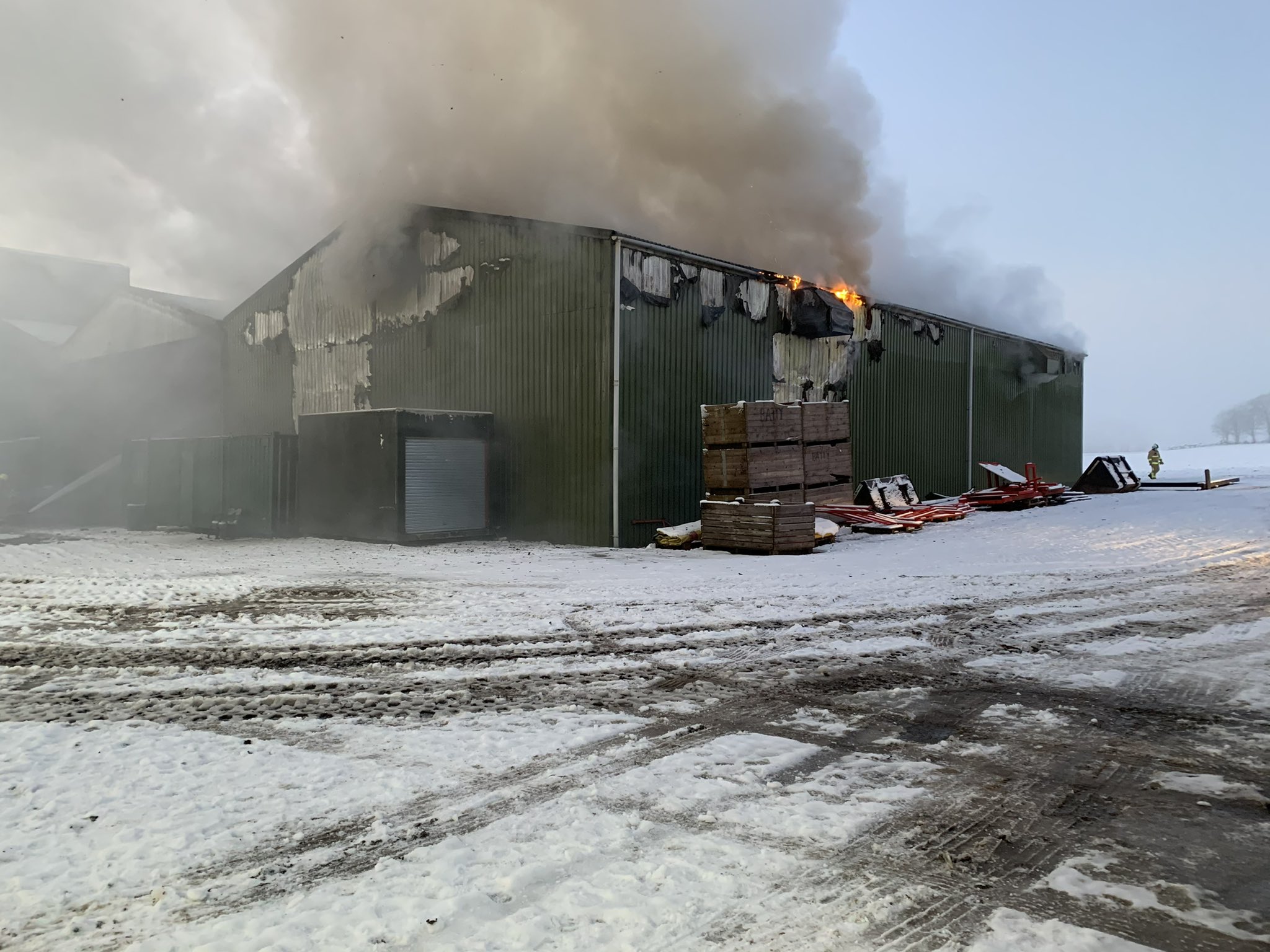 Fire crews fight fire in an agricultural unit at South Milford