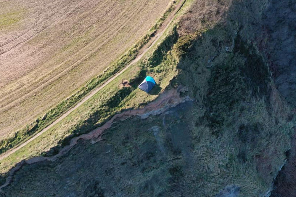 Updated: Police fine ‘completely irresponsible’ campers who pitched their tent next to a 280ft Whitby cliff edge