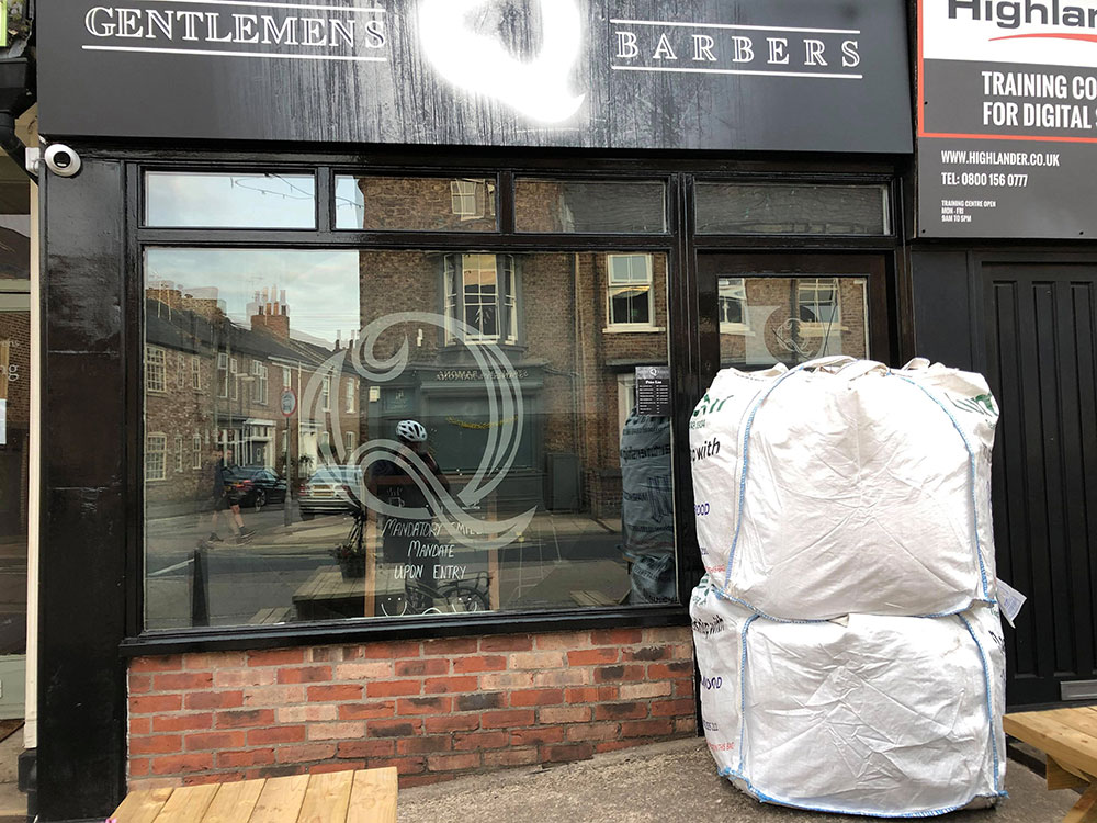Updated: Extreme measures! Council installs sandbag blockade to stop York barbershop reopening