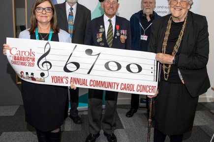 Charities receive £6,700 from York carol concert – but the presentation had to wait 17 months!