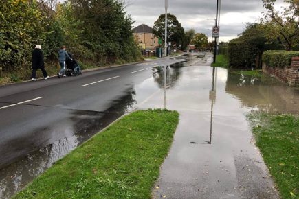 Burst main floods road in York