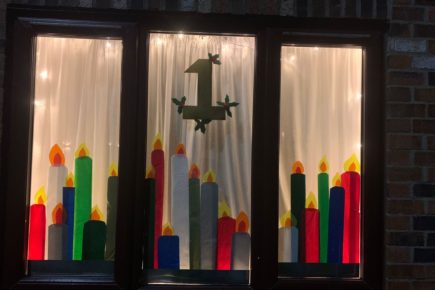 Villagers create giant Advent calendar using their front windows