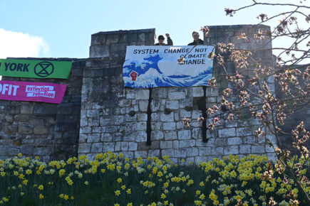 Pictures and video: Extinction Rebellion activists stage a banner drop on York city walls