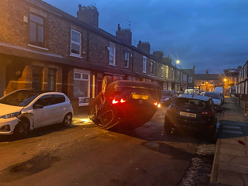 Dramatic pictures show car on its roof after crashing on York street