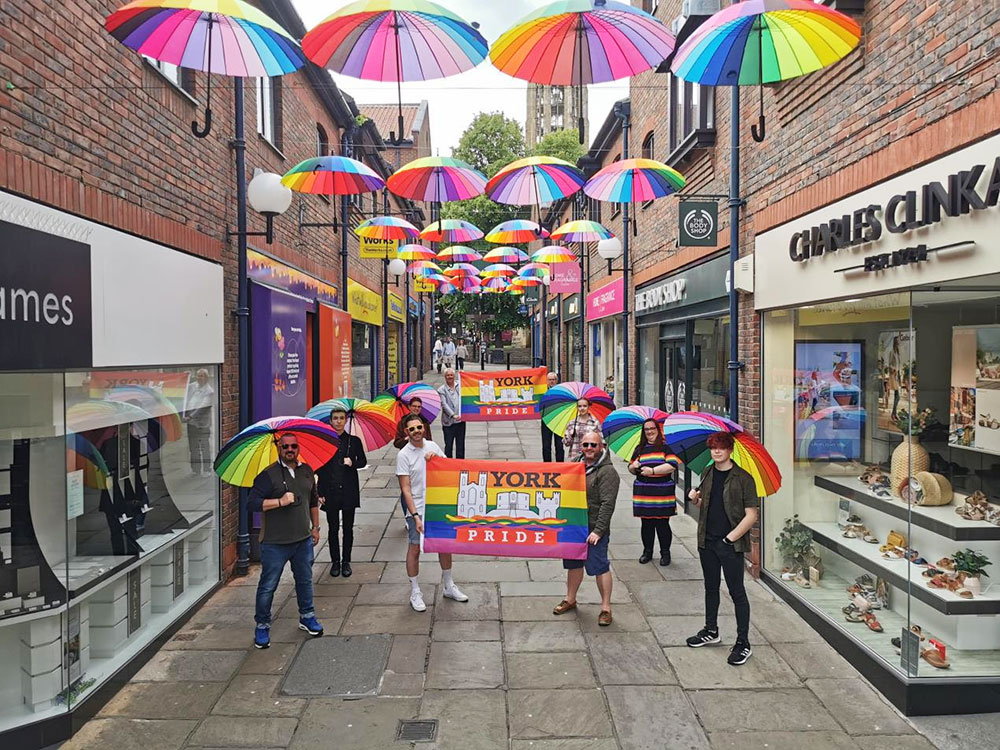 Rainbow brollies take pride of place over Coppergate