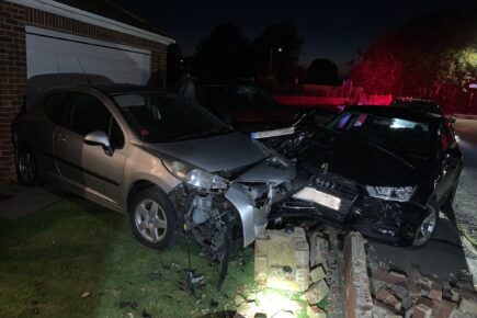 Man arrested after collision causes substantial damage to cars and property