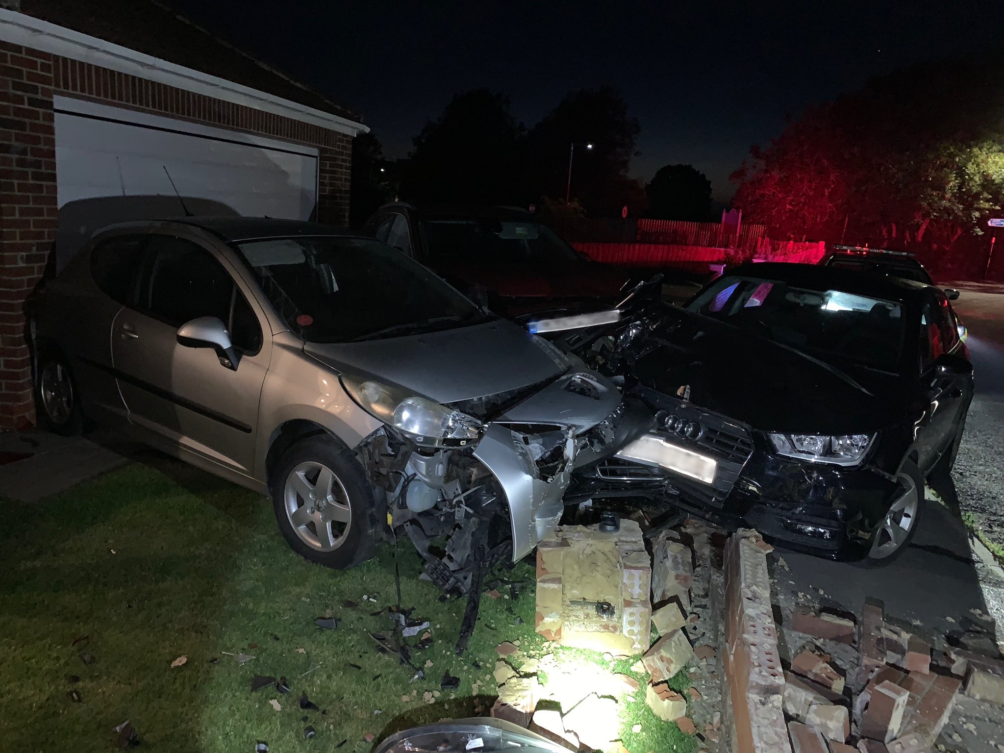 Man arrested after collision causes substantial damage to cars and property