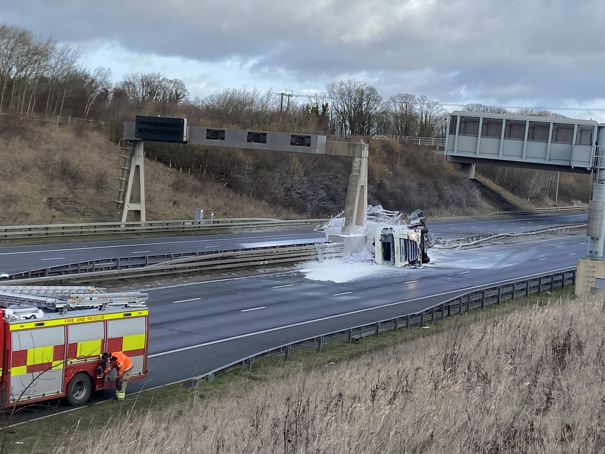 Driver taken to hospital after tanker overturns spilling ‘hazardous chemicals’ on the A1M
