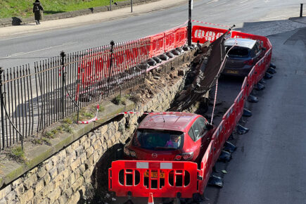 Updated: Railings flattened and wall partly demolished after York crash which left car on its side