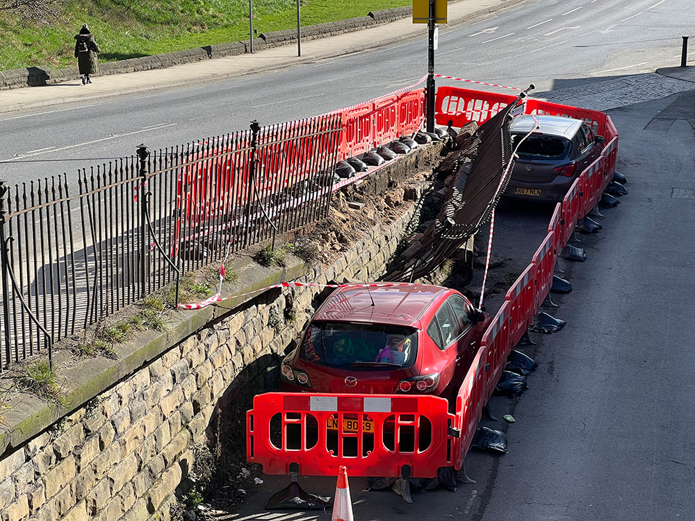 Updated: Railings flattened and wall partly demolished after York crash which left car on its side
