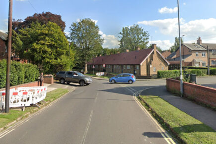 Car crashes into wall in York, narrowly missing woman