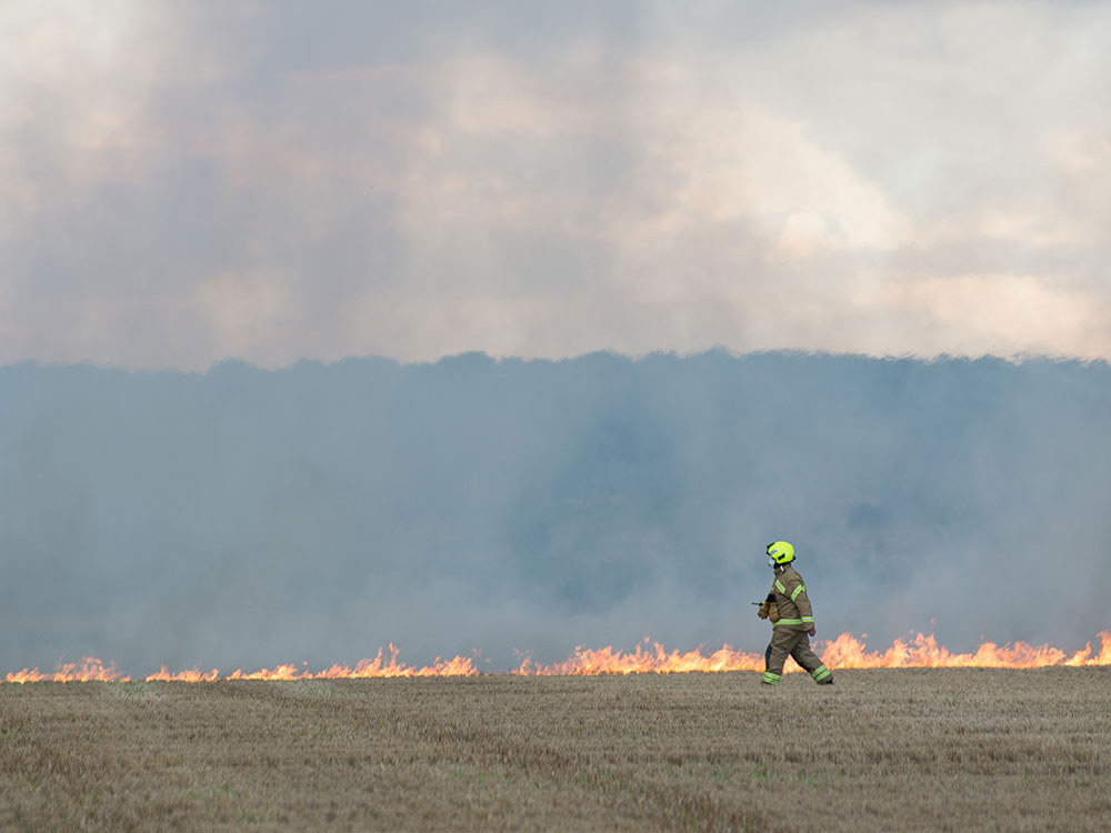 Five fire crews tackle large moorland fire sparked by train