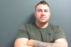 Armed robbers held manager in a cage as they plundered store of £22,000
