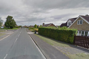 Driver taken to hospital after crashing through hedge in Tadcaster