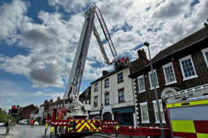 Fire crews called in as 6ft piece of stone in danger of falling from roof onto Selby street