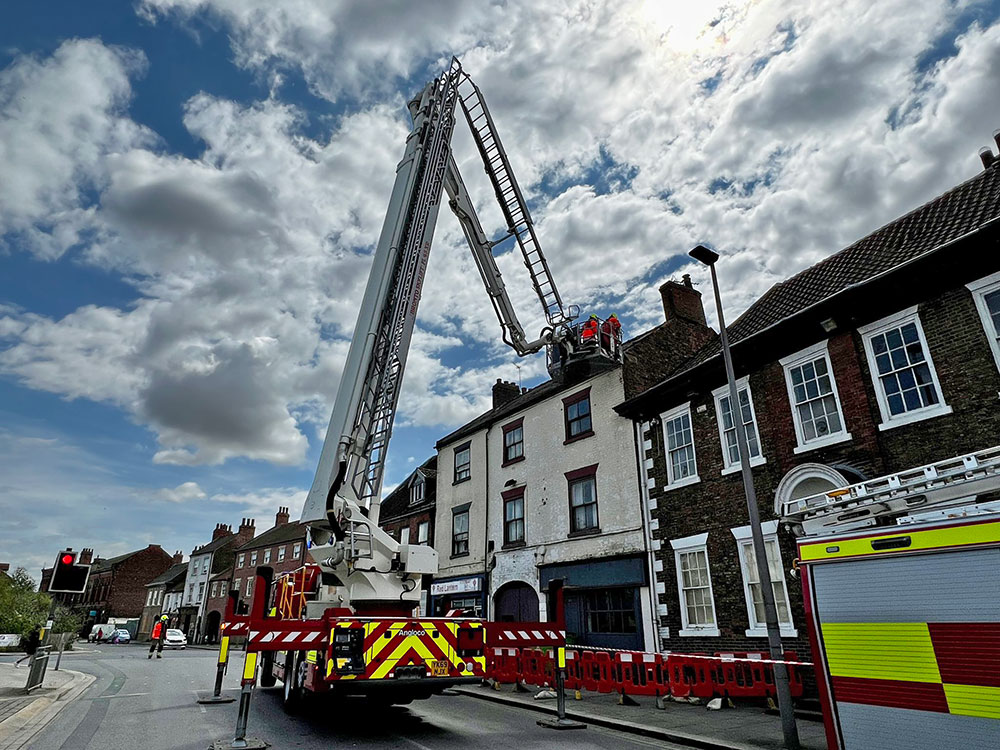 Fire crews called in as 6ft piece of stone in danger of falling from roof onto Selby street