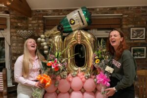 Two friends celebrate £10,000 charity milestone