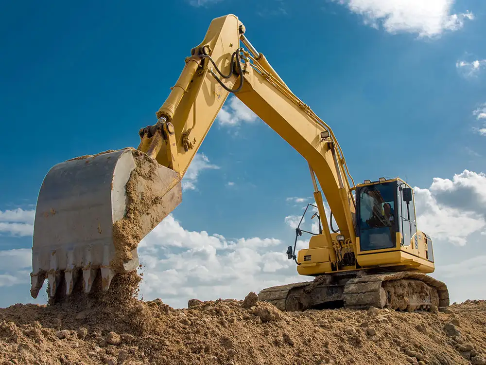 Landowner uses JCB to move fire away from hedge