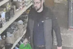 Police investigate an indecent exposure incident at a cash desk