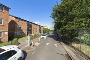 Woman in the care of paramedics after flat fire in York