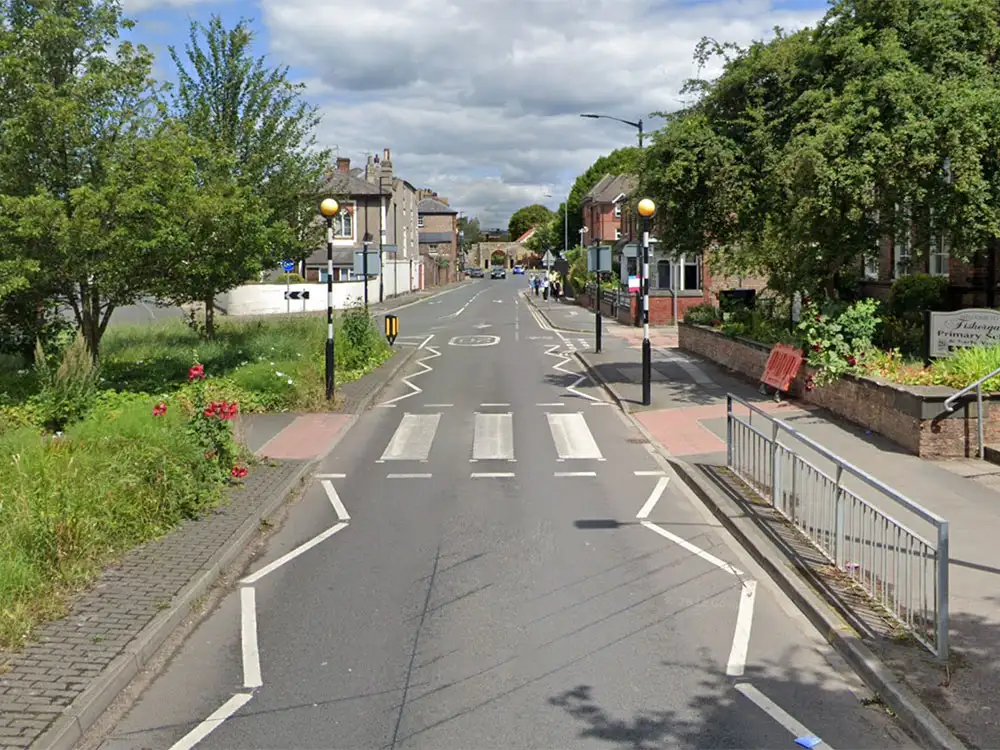 Two children nearly hit by cars next to York school