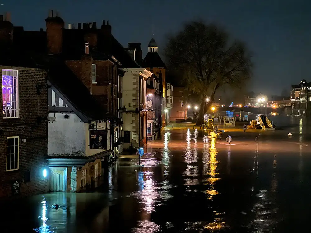 River levels hit new peak in the current flood – Water covers York road at both ends