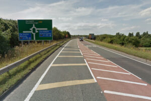 Woman and children hurt in hit-and-run crash at busy junction