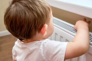 York child rescued after getting stuck behind a radiator