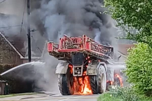 Farm vehicle bursts into flames and closes road