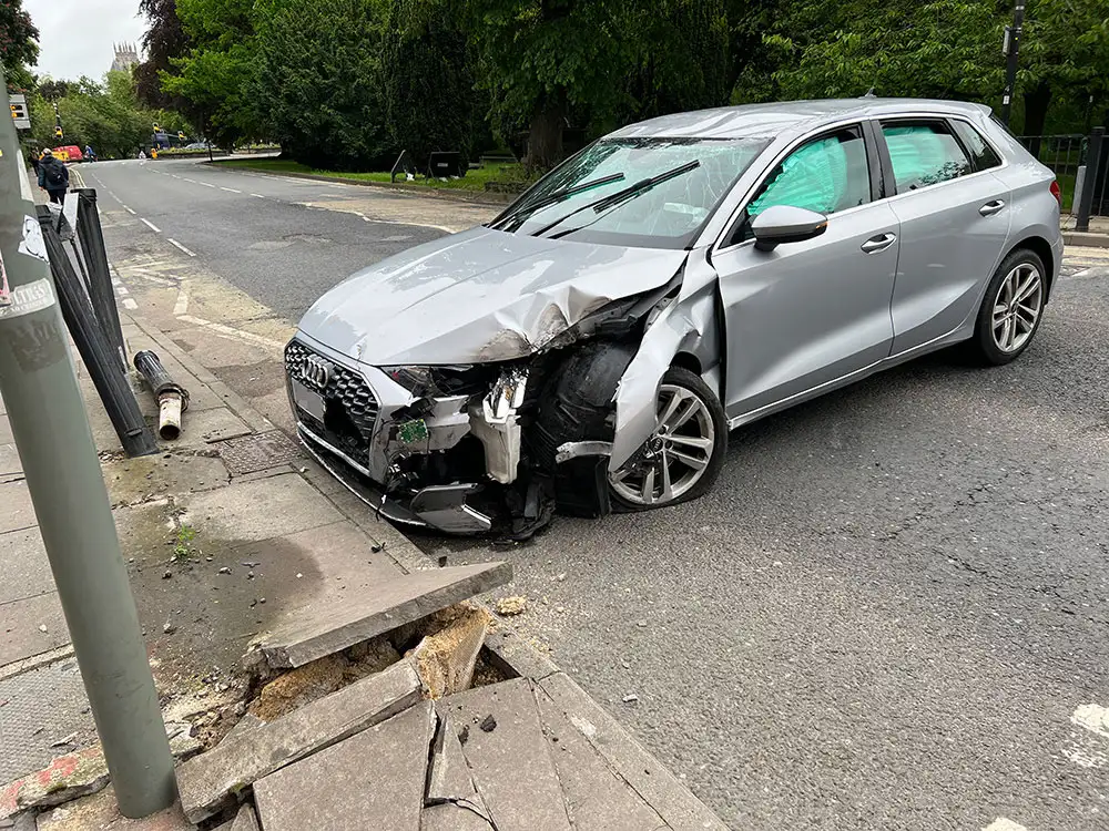 Updated: One person taken to hospital after car smashed into railings near York Station