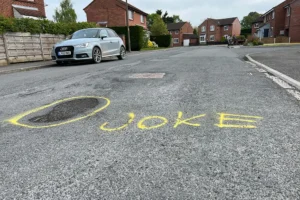‘Fill me!’ Mystery graffiti artist highlights potholes on York street
