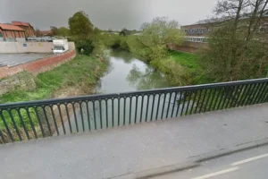 Man rescued after falling down riverside embankment